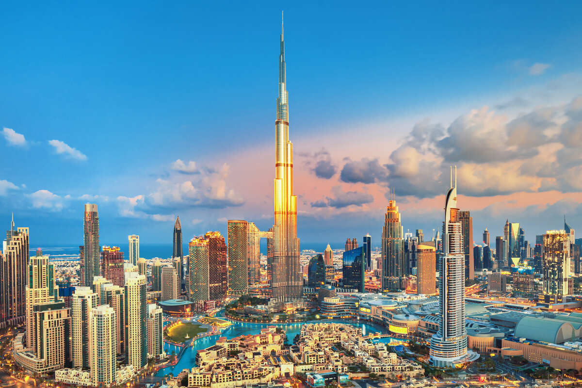 Skyline-Of-Dubai-United-Arab-Emirates-With-The-Tallest-Building-In-The-World-Burj-Khalifa-Reflecting-The-Sun-Shine-And-A-Sea-Of-Skyscrapers-Surrounding-It-Middle-East